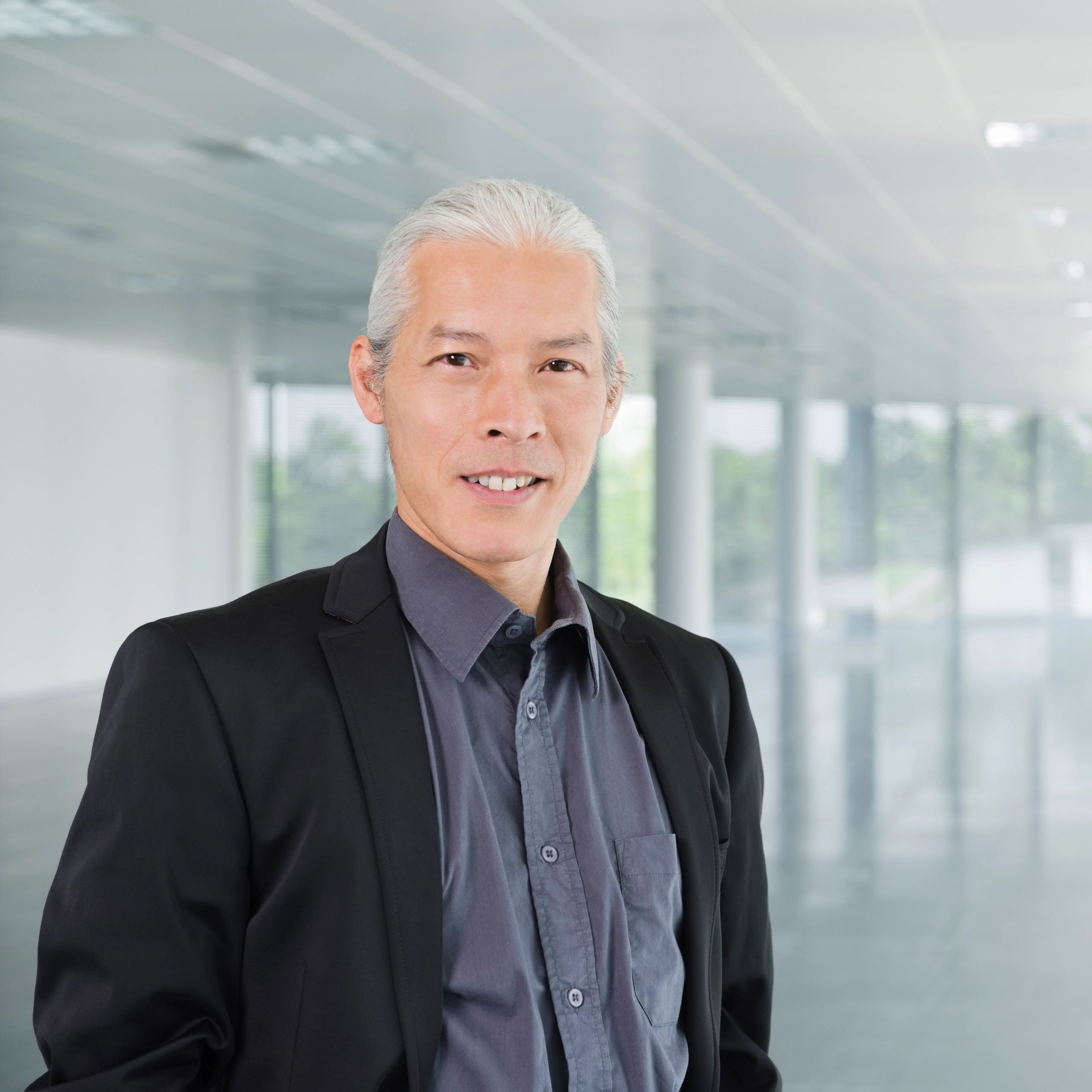 Professional headshot of a business executive